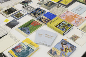 table covered in reference books around the themes of women artists