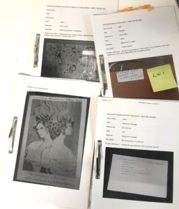 photograph of four simple printed catalogues