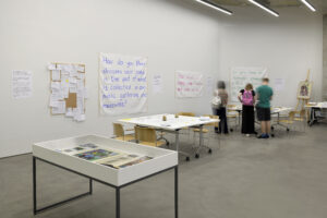 large studio with display of material inviting public response